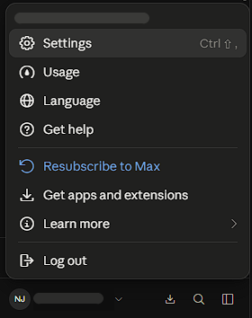 Claude's account menu, open, with Settings at the top